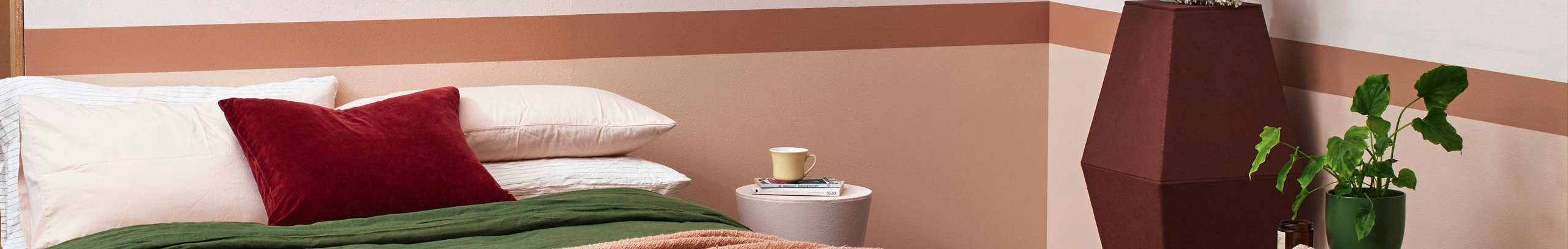 Bedroom with stripped paint and green theme