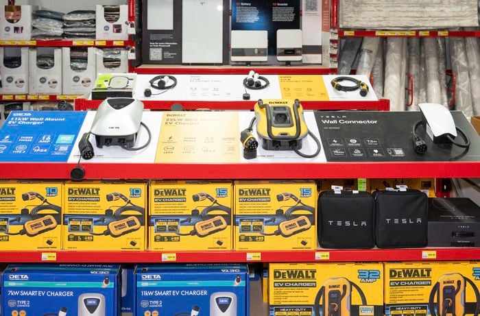 The image shows EV wall chargers from brands like DETA, DeWALT, and Tesla, with specifications.