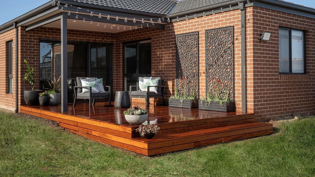 Backyard with a decking, undercover area and outdoor furniture.