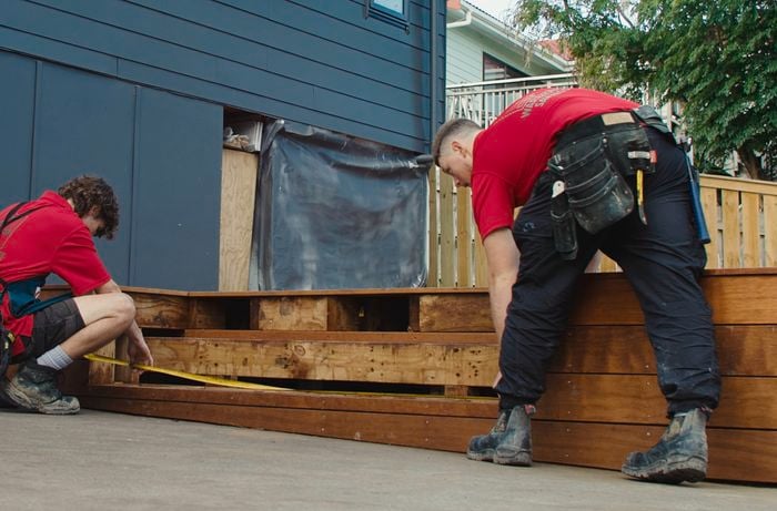 Bunnings team members building timber steps for decking