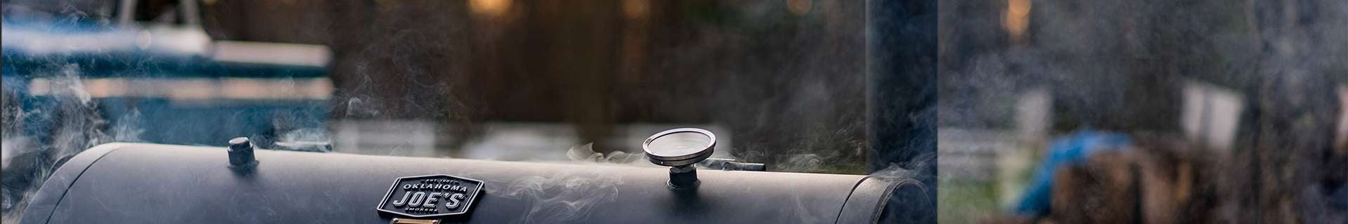Close up of smoke coming out of barbecue.