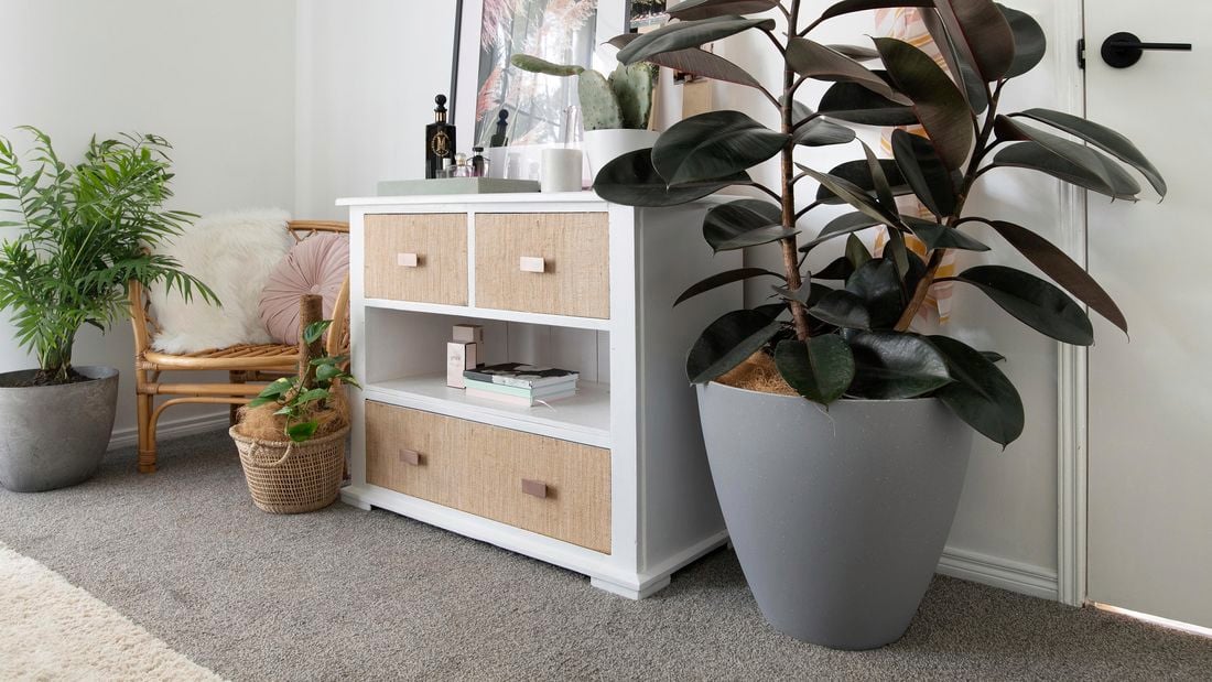 White chest of drawers with hessian covering on drawer fronts