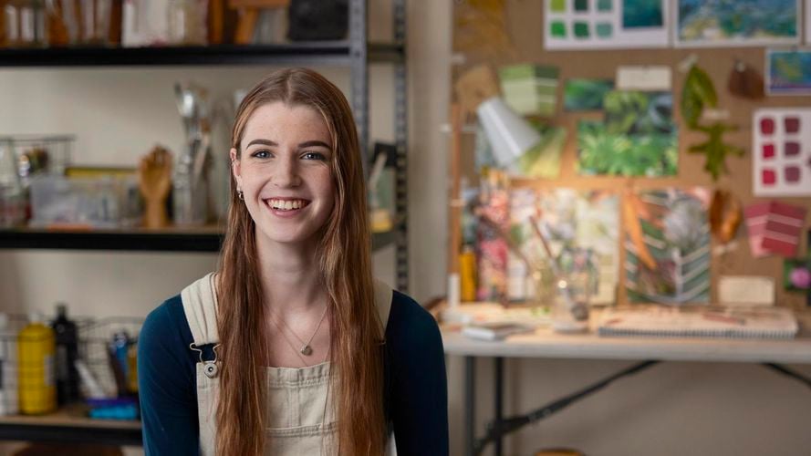 Bella, Team Member in painting overalls