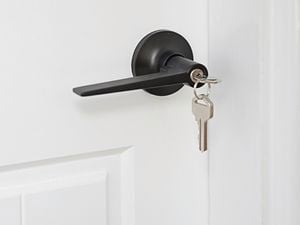 Door handle with a key hanging from it's lock