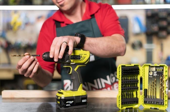 Team member showing assorted drill bits