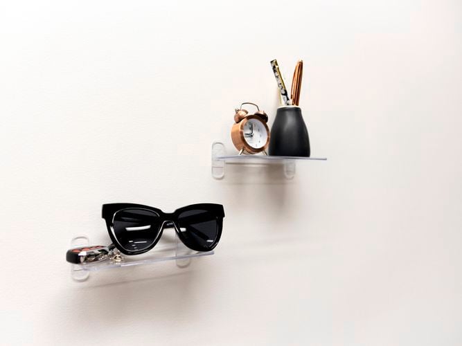 glasses and clock on floating shelves