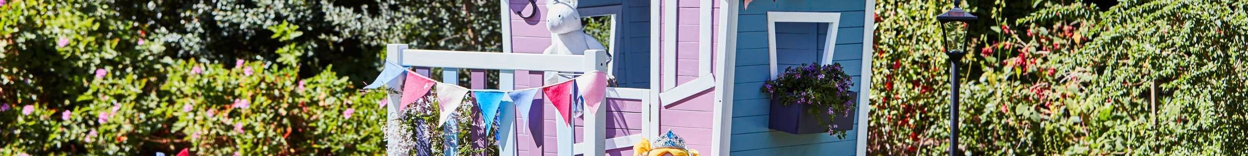 Kids cubby house painted purple and pink