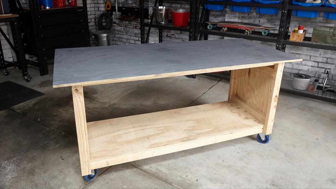 A mobile workshop bench made from pine and plywood with swivel castor wheels