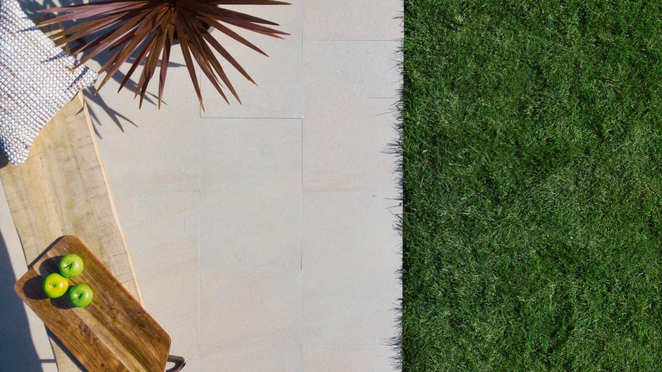 Tuscan Path ‘Roman Stone’ garden edging lining a garden bed