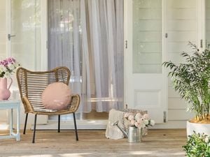 An outdoor furniture setting in a spring garden