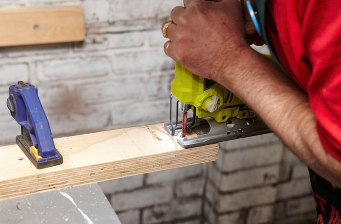 Person cutting ply.