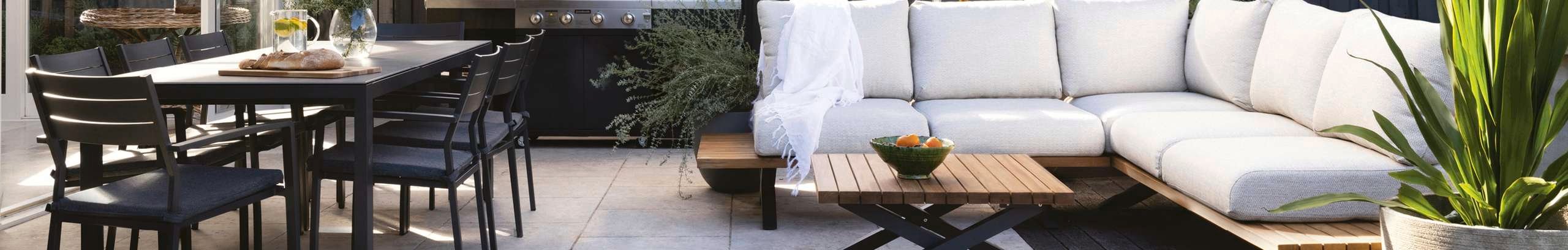 Back yard with corner lounge and dining table set 