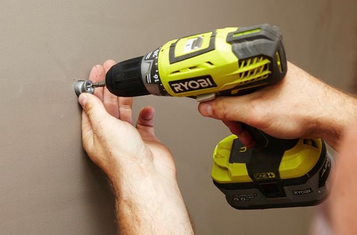 DIY Step Image - How to install a towel rail into plaster . Blob storage upload.
