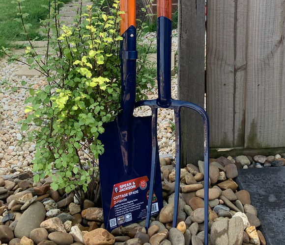 Close up of cottage spade and garden fork