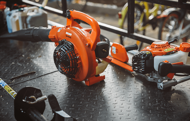 A range of Echo tools on a steel bench