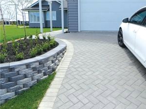 paved driveway with white car parked on it