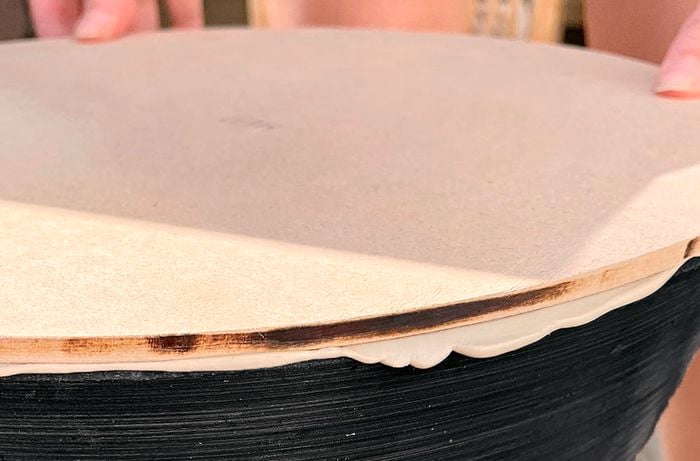 An MDF panel secured to a planter top with construction adhesive