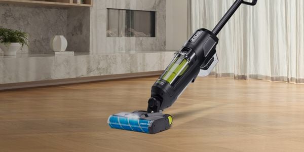 Ryobi cleaning Vac in shot being used to clean floors