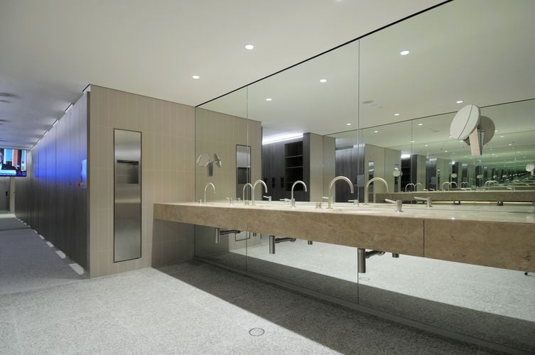 Commercial bathroom with floor to ceiling mirrors