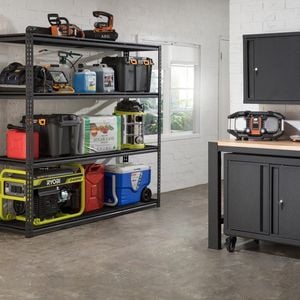 Garage featuring the Pinnacle modular series and heavy duty shelf.
