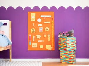 Colourful DIY busy board with interactive hardware pieces