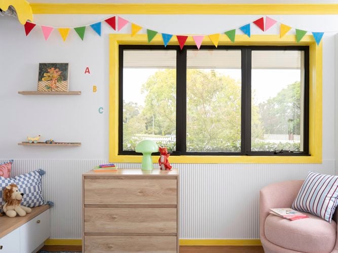 Playful kid-core window trims brighten a children’s space