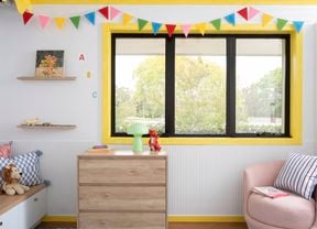 Playful kid-core window trims brighten a children’s space