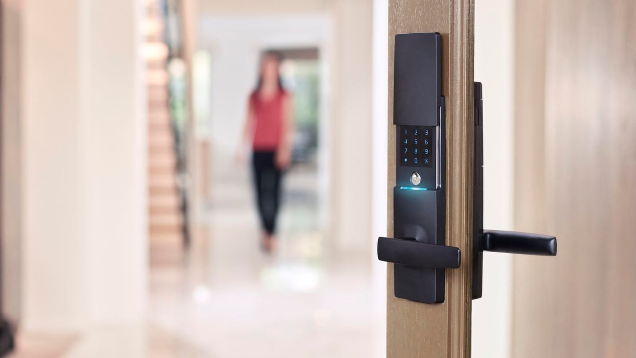 A Gainsborough smart lock on a glass entry door with timber frame