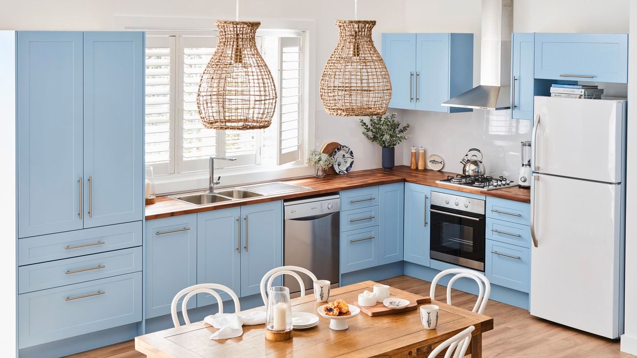 Kitchen with blue cabinetry.