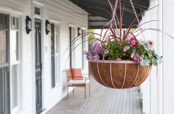 A pink upcycled hanging planter