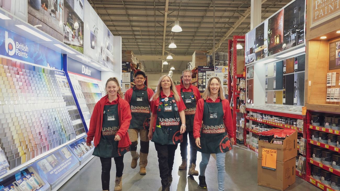 Group of team members walking in the paint section
