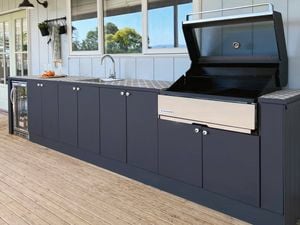 outdoor kitchen set up with a bbq