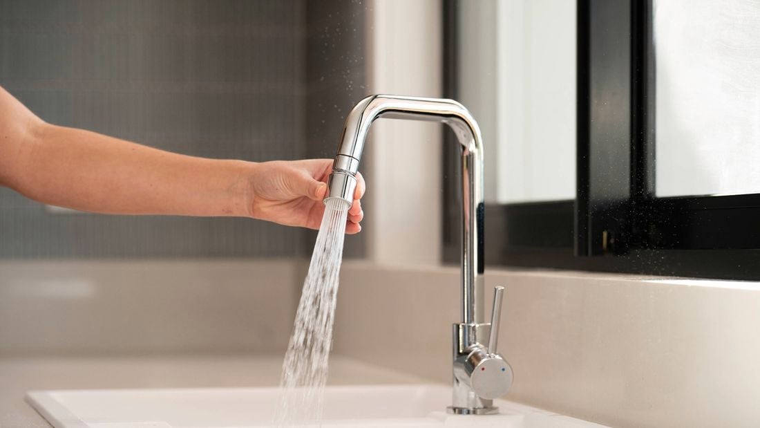 Finished swivel tap head installation on a kitchen sink tap