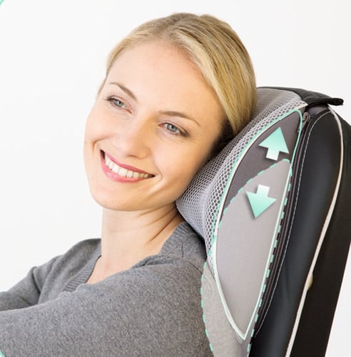 A lady using a heated head rest