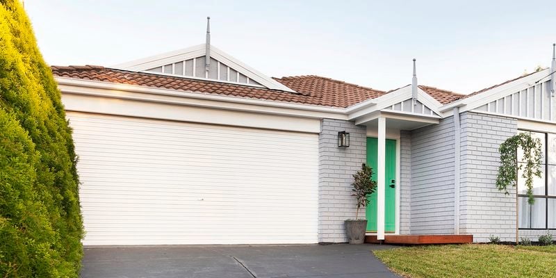 Front of a house, showing garage door.