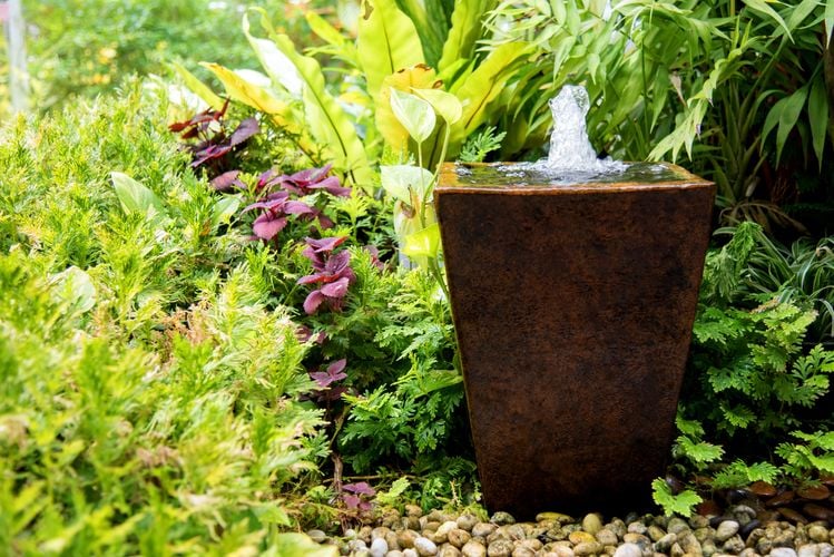 Small water fountain in garden