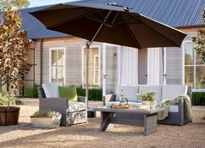 wicker outdoor setting in shot with umbrella