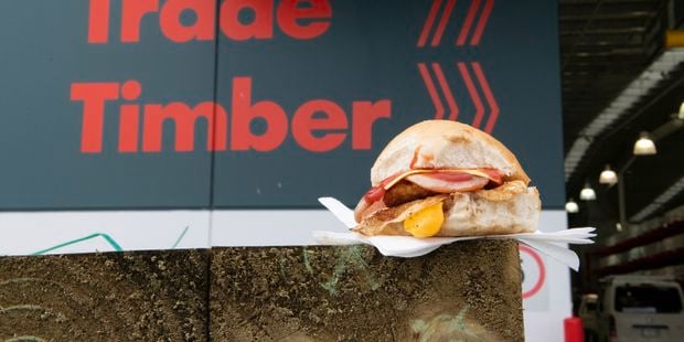 Trade bunnings store,  showing a egg and bacon roll sitting on some timber