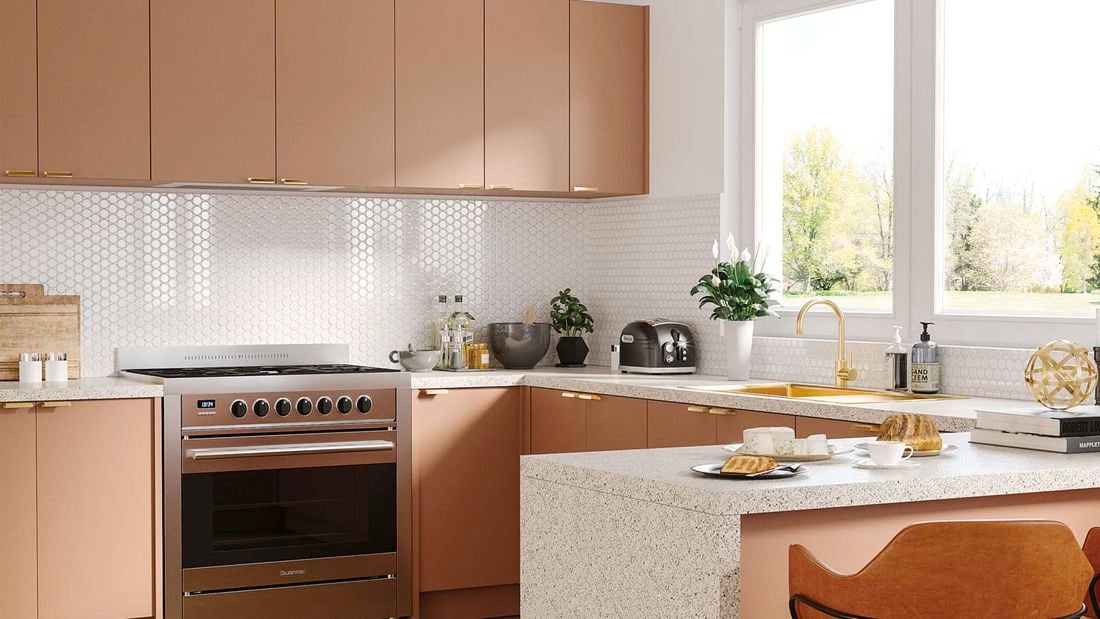 Pink kitchen with white honeycomb tiles and granite benchtop