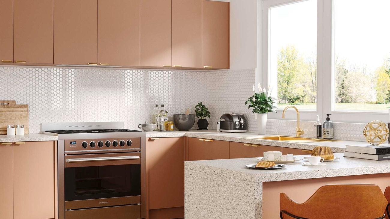 Pink kitchen with white honeycomb tiles and granite benchtop
