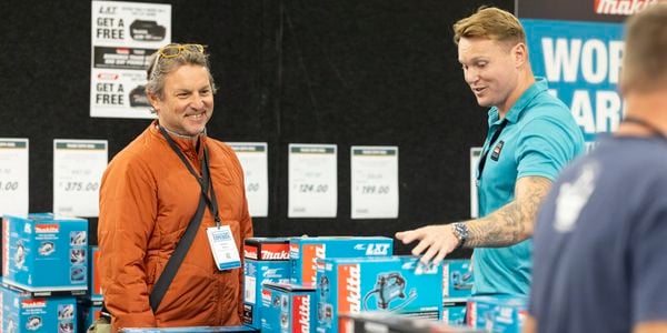 Customer shopping at NZ trade expo for Makita tools