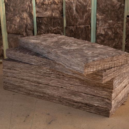 Stacked insulation on jobsite.
