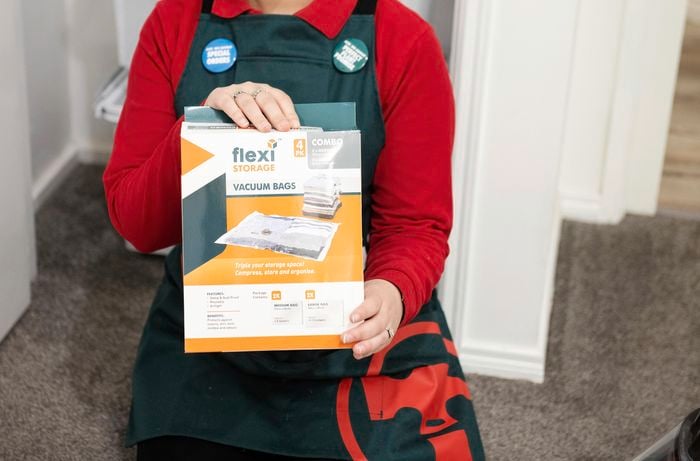 Person holding box of vacuum seal bags