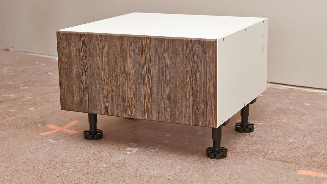 A single drawer cabinet with adjustable feet