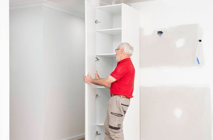 Remove the pantry door and shelves  from its hinges