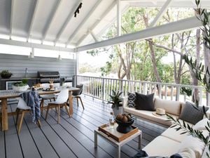 Outdoor area with HardieDeck decking, outdoor table and chairs and plants.