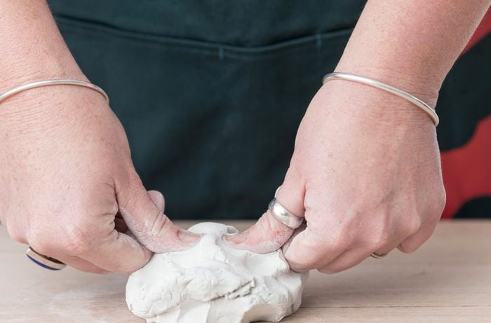 Clay being prepared for molding