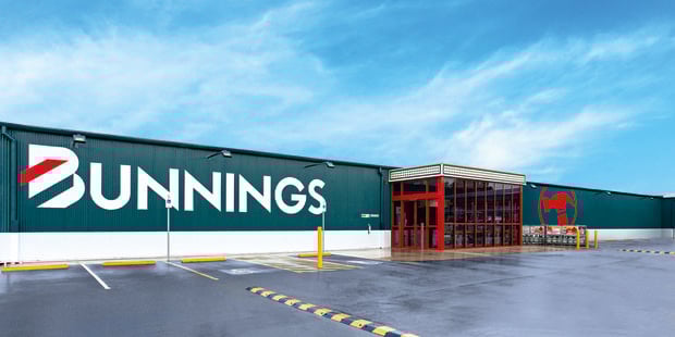 Wide shot of the exterior of Portland warehouse with blue sky and spacious parking
