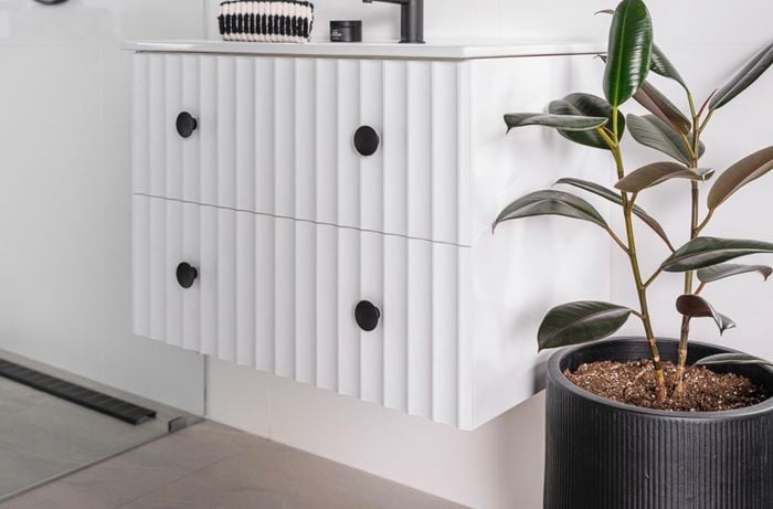 A finished vanity with scallop panels