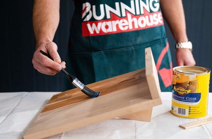 Apply stain to timber